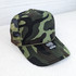 Camo Foam Trucker Hat, green and black camouflage pattern with mesh sides and curved brim.