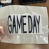 GAME DAY Puff Embroidered HAT/POCKET Patch - Various Colors, black embroidered 'GAME DAY' patch on transparent plastic packaging.