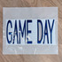 FLAWED Large Game Day PUFF Embroidered Patch - Various Colors, blue embroidered patch with the text 'GAME DAY' on a white background.