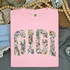 Boho Floral Names DTF Heat Transfer, floral pattern inside the word 'GIRL' on a pink T-shirt.
