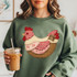 Faux Patchwork Cottagecore Chicken DTF Heat Transfer, woman wearing a sweatshirt with a patchwork chicken design.