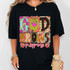 God Grows Purpose DTF Heat Transfer, colorful floral and animal print design on black T-shirt.