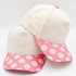 Cotton Polka Dot Blank Hats, set of plain cotton caps with pink polka dot brims and pink button on top.