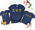 Be Happy Let It Be Be Kind INFANT Screen Print Heat Transfer, navy blue infant T-shirts with yellow bee graphic and inspirational phrases, displayed with baby shoes and floral decoration.