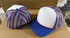 Patriotic Stripes Foam Trucker Hat, front view and back view of the baseball cap with red, white, and blue patriotic design and mesh panels.