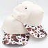 Cow Print Brim Baseball Cap – Boutique & Hat Bar Favorite, stylish beige baseball cap with cow print brim in brown and white.