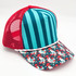 Farmhouse Chicken Print Blank Trucker Hat, colorful cap with red mesh back, blue and teal striped front panel, and festive holiday themed brim with chickens and stars design.