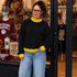 Blank Mockneck Sweatshirt — Preorder | Multiple Colors, woman wearing a black sweatshirt with yellow accents in a clothing store.