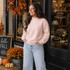 Blank Mockneck Sweatshirt — Preorder in multiple colors, worn by a woman standing outside a boutique with fall decorations.