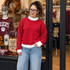 Blank Mockneck Sweatshirt — Preorder | Multiple Colors, woman wearing a red mocknech sweatshirt with white collar and cuffs, in a retail store.