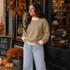 Blank Mockneck Sweatshirt — Preorder | Multiple Colors, woman wearing beige mockneck sweatshirt in fall outdoor setting with pumpkins and autumn leaves.