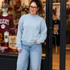 Blank Mockneck Sweatshirt — Preorder | Multiple Colors, woman wearing light blue mockneck sweatshirt in front of a retail store display.