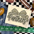 Camo Bow School Mascot DTF Heat Transfer, camo-themed school mascot design with a bow and lettering, for customizing apparel.