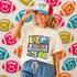 Retro Mascot Collage DTF Heat Transfer, colorful football and sports team-themed design featuring a jaguar, helmet, football, and stars on a woman's white T-shirt, with footballs and smiley face decorations in the background.
