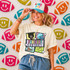 Retro Mascot Collage DTF Heat Transfer, vibrant colorful design with football, panther mascot, and football elements on a woman's t-shirt, against a backdrop of football-shaped wall decorations.