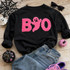 BOO Neon Pink Fluffy Patch, pink fuzzy Halloween-themed patch on a black sweatshirt with a ghost face design.