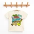 Colorful On My Way To... Back to School DTF Heat Transfer, a vibrant and playful children's t-shirt with school-themed graphics including a school bus, book, crayon, paper airplane, and a sign, perfect for back-to-school apparel.