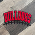 Bulldogs Red & Black Chenille Football Patch, embroidered sports patch with the word 'BULLDOGS' in bold red letters outlined in black, featuring a football lacing design at the bottom.