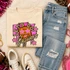 Pink Glitter Mascot - 62 teams - DTF Heat Transfer, graphic design featuring a cartoon jaguar with pink stars and text 'Let's Go Jaguars' on a beige sweatshirt, surrounded by jeans, sneakers, and accessories.