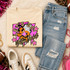 Pink Glitter Mascot - 62 teams - DTF Heat Transfer, featuring a pink glitter mascot graphic on a cream-colored sweatshirt surrounded by casual clothing and accessories.
