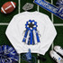 Homecoming Mum Sequins Patch - Red, an embroidered patch featuring a blue and black floral design with ribbons, displayed on a white sweatshirt with football accessories and decorations for a homecoming event.
