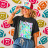 Neon Star Mascot DTF Transfers | School Spirit Mascot Collection, vibrant neon superhero mascot design with sunglasses topped by a woman wearing a cap and t-shirt.
