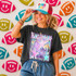 Neon Star Mascot DTF Transfers | School Spirit Mascot Collection, colorful glowing star design on a black T-shirt worn by smiling woman with a baseball cap.