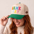 Game Day colorful puff embroidered heat press hat patch applied to cream and green baseball cap
