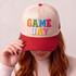 Game Day Puff Embroidered Hat Patch | Heat Press Patch, colorful embroidered patch on baseball cap with red brim, woman holding hat, casual fashion accessory.