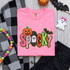Colorful Spooky sequin heat press patch with pumpkin ghost spiderweb and bat details on pink shirt