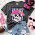 Dotted Star Mascots DTF Transfers | School Spirit Mascot Collection T-shirt with a cute bulldog wearing star-shaped sunglasses, surrounded by colorful star and polka-dot patterns, displayed alongside accessories like a pink foam finger, pink sunglasses, pink bracelet, and a football.