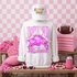 Loud & Proud Mascot DTF Transfers | Retro School Spirit Mascot Collection, white sweatshirt with pink and purple mascot graphic and text, wearing a white cap with colorful lettering, surrounded by pink sports-themed decorations on a pink checkered background.