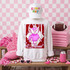 Loud & Proud Mascot DTF Transfers, Retro School Spirit Mascot Collection design on a white sweatshirt with a cartoon mascot and bold text, in a decorated pink-themed sports fan setup.