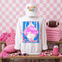 Loud & Proud Mascot DTF Transfers | Retro School Spirit Mascot Collection featuring a white sweatshirt with a vibrant cartoon mascot design and colorful lettering, paired with a white cap, pink accessories, and sports-themed items, set against a pink checkered background.