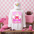 Loud & Proud Mascot DTF Transfers | Retro School Spirit Mascot Collection, white sweatshirt featuring a neon pink and red cartoon mascot with the words 'LOUD' and 'el Proud' in bold lettering, surrounded by pink accessories and themed decor.