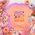 HP Hallelujah DTF Transfer, witchy Halloween themed t-shirt with colorful unicorn and star graphic surrounded by fall pumpkins, flowers, and cozy autumn accessories.