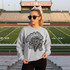 Dotted Mascot DTF Transfers | School Spirit Mascot Collection, a sweatshirt featuring a tornado mascot design worn by a woman on a football field.