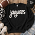 White Jaguars fluffy heat press appliqué patch with script lettering displayed on a black sweatshirt.