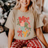 Merry hand-drawn DTF transfer with stacked doodle lettering, holly, stars, bows, and a candy cane in red, green, and gold