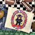 Texans mascot DTF transfer with bull character in navy jersey and star sunglasses inside a pink and gold star frame
