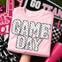 Game Day DTF transfer with polka dot block lettering on a pink shirt