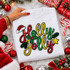 Holly Jolly sequin Christmas patch with red green and gold lettering, Santa hat, holly and silver glitter backing