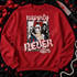 Happily Never After Halloween DTF transfer featuring a fairy-tale princess in a hockey mask holding a bloody knife, a Ghostface-style figure behind her, framed in zebra print with blood-splatter lettering Shown on a Cardinal Red crewneck sweatshirt.