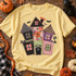 Whimsical patchwork haunted house DTF transfer with gingham, leopard, floral, and polka dot fabric-style panels, blanket-stitch edges, bats, and a purple crescent moon Shown on a Butter t-shirt.