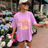 Doing My Best Club DTF transfer in bold pink and yellow retro lettering with stars on a purple shirt