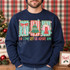 Oh Come Let Us Adore Him Christmas DTF transfer with scalloped striped panels featuring a bow, Christmas tree, and angel above colorful block lettering Shown on a Navy crewneck sweatshirt.