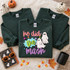 He Did the Mash Halloween DTF transfer with two friendly white ghosts, colorful stars, and playful patterned script lettering Shown on a Fan Dark Green crewneck sweatshirt.