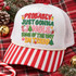 Probably Just Gonna Jingle Some Of The Way Im Tired Christmas DTF transfer in stacked polka-dot varsity lettering with hand-drawn ornaments, bell, candy cane, stocking, stars, and mini Christmas trees Shown on a white front panel, red and white striped bill, cream rope, white mesh back trucker hat.