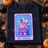 The Dreamer clawed-glove tarot card DTF transfer with fedora-wearing horror kitty illustration in purple and blue