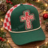 Jesus Saves distressed cross DTF transfer in red, green, and cream with weathered hand-drawn Christmas-inspired texture Shown on a forest green front panel, cream rope, red and white checkered mesh back trucker hat.